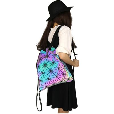 China 2019 Hot Selling Lingge Colorful Geometric Women Backpack Holographic Reflective Material Luminous Girls Travel Shoulder Drawstring Bag for sale