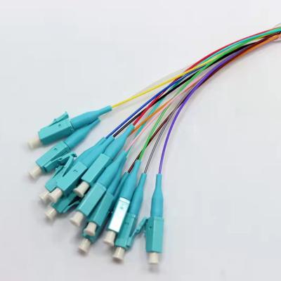 China FTTH Less than 0.2dB LC/UPC Insertion Loss Connector SM Colors 12 Fiber 0.9mm 1.5M Fiber Optical Pigtails G652D FTTH for sale