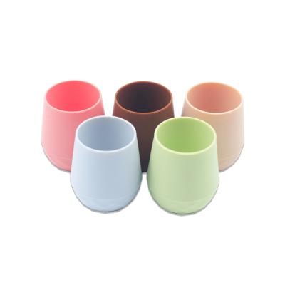 China BPA Free Stocked Tiny Toddler Kids Silicone Baby Training Cup Easy To Grip Silicone Baby Cup For Drinking for sale