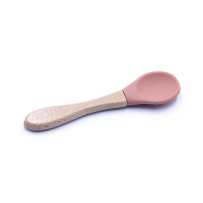 China Custom Color Stocked Baby Spoon Food Grade Silicone Baby Feeder Bamboo Spoon With Wooden Handle for sale