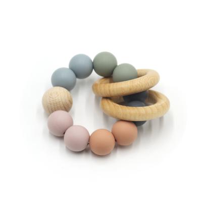 China Mix Color Baby Teether Silicone Stocked Bead Ring Wood Beads Wooden Teether for sale