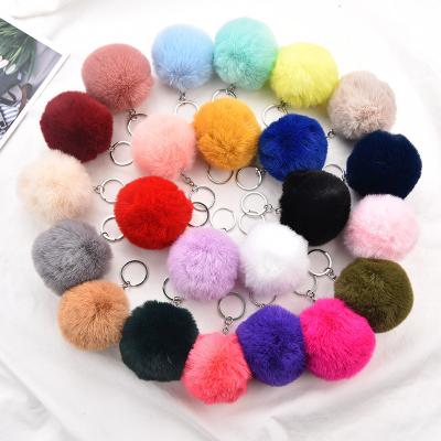 China 2021 Wholesale Cute Eco-friendly Product Bag Accessories 8cm Puff Ring Pom Pom Key Chains Custom Made Fluffy Key Chain for sale