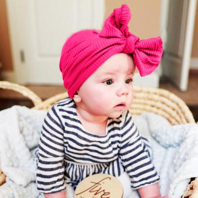 China XUFANG 2021 New Fashion Dobby Baby Hats Wholesale Solid Color Soft and Comfortable Big Bow Children Turban Hat for sale