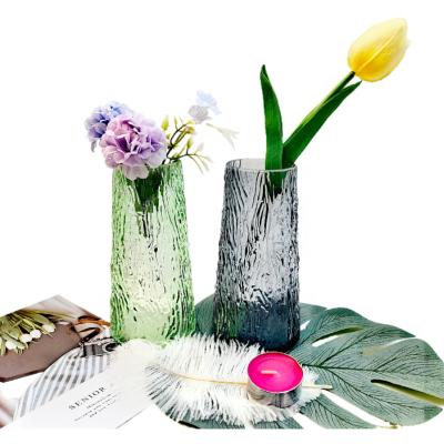 China Customized unique design high quality green and gray embossed conical clear glass flower vase for home decoration for table top for wedding for sale