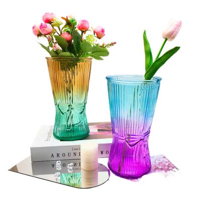 China Wholesale Unique Design New Arrival Nordic Elegant Bowknot Pattern Glass Creative Custom Colored Vases For Flower Arrangements For Home Decor for sale