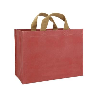 China Waterproof Durable Reusable Paper Bag Custom Washable Eco-Friendly Grocery Packaging Bag for sale