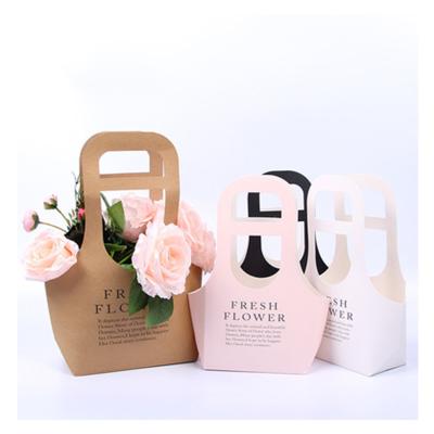 China Tondo 2022 Handmade Take Away Flower Wrapping Paper Flower Plant Bag Plant Florist Bouquet Handle Flower Bag for sale