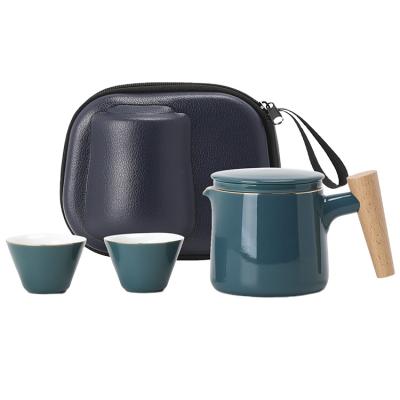 China Viable wooden handle green color glazed high quality Chinese style travel tea set ceramic teapot with cups for sale