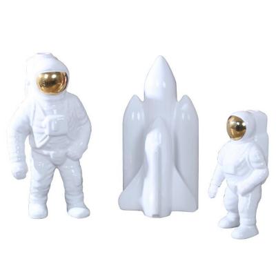 China Modern Rocket Astronaut Figurine Design Ceramic Artwork Home Decor for sale