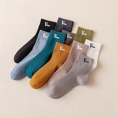 China Sporty Men's Solid Color Bumps Feet Cotton Tube Mens Sports Crew Socks Warm Stamping Casual Socks for sale