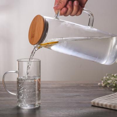 China High Quality Glass Jug Stocked Borosilicate Glass Pitcher With Wooden Lid Glass Drinking Jug 43oz for sale