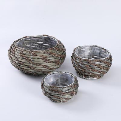 China Supplier Modern Wholesale Modern Oval Straw Flower Pot Rattan Wooden High Quality Handmade Planter With Plastic Liners Customized for sale