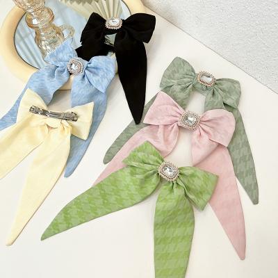 China 2022 European and American style fashion solid color faux stone bow hair clips fabric hair accessories bow hairpin for women for sale