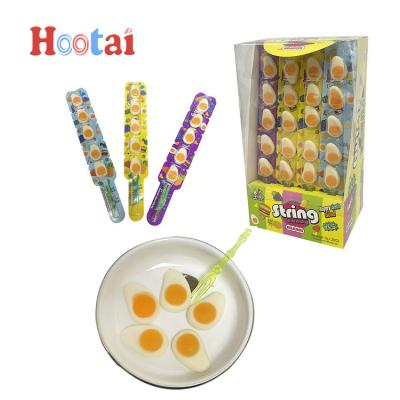 China Natural High Quality Candy Soft Jelly Fried Egg Shaped Gummy Candy Mini Stick Jelly Gummy Candies for sale