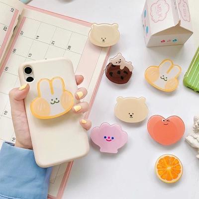 China Wholesale Custom Logo Acrylic Eject Mobile Phone Holder With Cute Design Phone Socket for Cell Phone Grip for sale