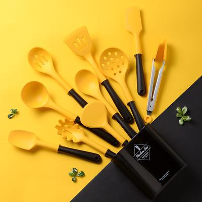 China New Viable Kitchenware Set Accessories Tools Silicone Cookware Set 11pcs Yellow Cookware Set With Rack for sale