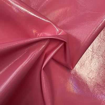 China Waterproof PU Faux Smooth Shiny Leather Is Used For Clothing Fabrics for sale