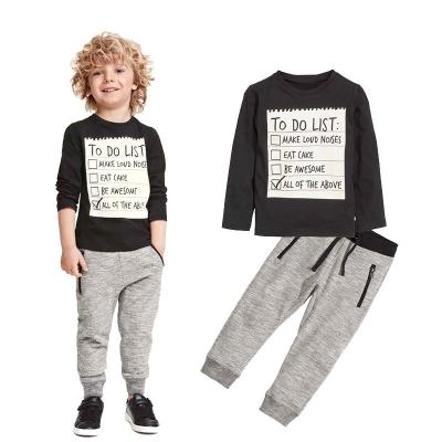 China Hot Sale Europe Kids Sports Boy Sports T-shirt With Black Letters + Pants Cotton Two Piece Suit for sale