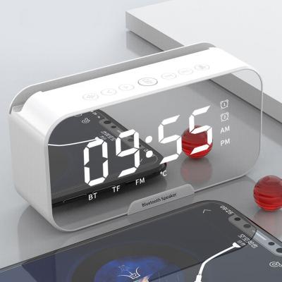 China New FM Wireless Alarm Clock Speaker Mini Mirror Gift Card Collection Wireless Broadcasting Speaker for sale