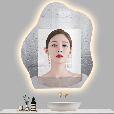 China OEM/ODM Body Induction Wall Hanging Irregular Shape Lighted Mirror With Bluetooth Led Lighting for sale