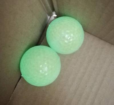 China 2 piece fluorescent golf balls with logos easy to find in ningt balls night golf balls in dark practice golf ball by evening standard for sale