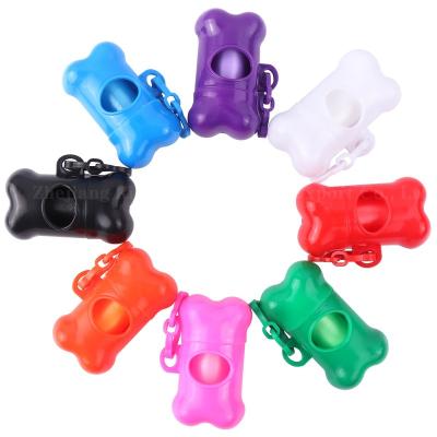 China Shiny Stocked Dog Poop Bag Dispenser Bone Shape Portable Multi Color Pet Bag Waste Holder for sale