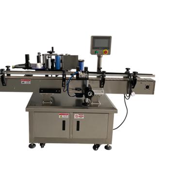 China automatic food round bottle labeling machine, self adhesive positioning labeling machine, automatic label labeling machine for sale