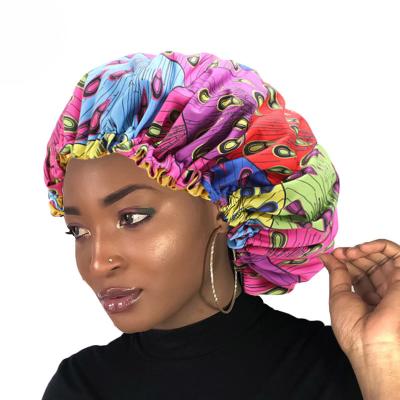 China Fashionable Jstar Africa women print round double layered nightcap satin sleep cap beauty hair care hat for sale