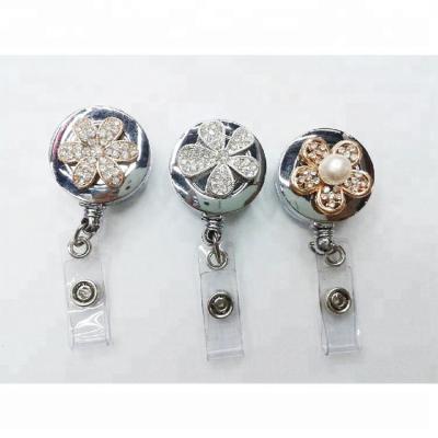 China We can OEM. retractable flower push button badge reel wholesale for sale