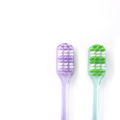 China Tapered Transparent Handle High Quality Double Handle Stiffened Adult Toothbrush for sale