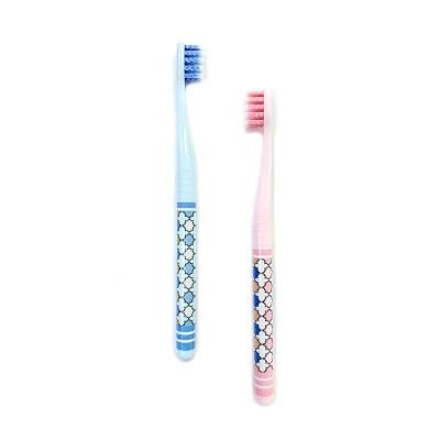 China Flat Hole Tucking With Spiral Bristle Flat Hole Tucking Spiral Bristle Factory High Quality Toothbrush With Customized Logo for sale