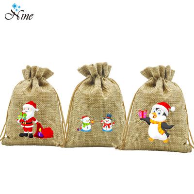 China 100% Canvas Christmas Gift Bag Candy Drawstring Bag Cartoon Pattern Gift Canvas Pouch for sale