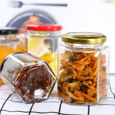 China Hexagonal 280ml Food Jar Glass Honey Jar Glass Food Honey Storage Bottle With Lid for sale