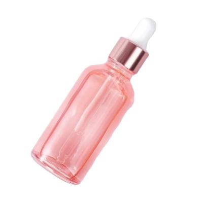 China Hot Pink Cosmetic Essential Oil 100ml Custom Essential Hair Oil Dropper Cosmetic Glass Bottles With Rose Gold Cap Top for sale