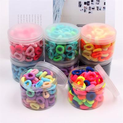 China Hair accessories for children 100pcs/box fashion high stretch colorful seamless kids mini size rubber band hair ring for sale