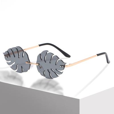 China Fashion Sunglasses 2021 Fashion Trending Women Rimless Leaves Frames Shades Sun Glasses Sun Glasses for sale