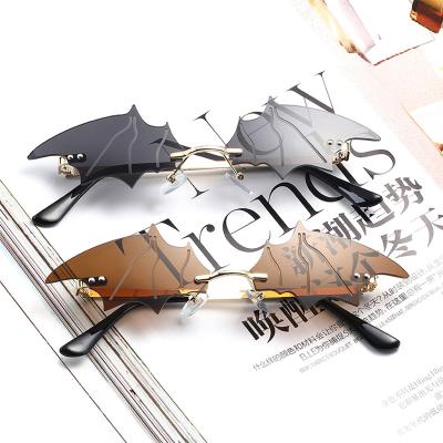 China YJ10145 2021 Cool Metal Frame Rimless Sunglasses Trendy Fashion Party Halloween Bat Shaped Cool Women Men Shading Sunglasses for sale