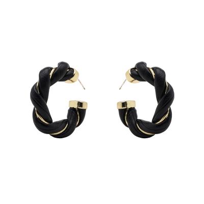 China TRENDY Shiny Leather Non Tarnish Gold Colored Earrings Twisted Faux Leather 925 Needle Hoop Earrings - Free Sample for sale