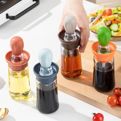 China New Design Sustainable Plant Cactus Shape Glass Olive Oil Bottles With Silicone Brush Dropper Oil Measuring Dispenser For Cooking BBQ for sale