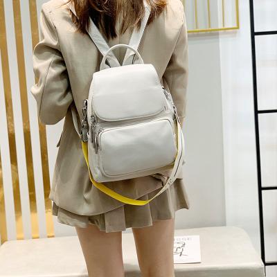 China 2021 fashion one-shoulder waterproof handbags wild new double-shoulder bag head layer whip natural fall ladies backpack leather for sale