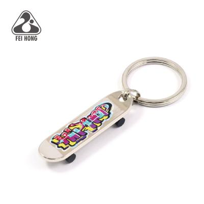 China No Mold Fee Advertising Custom Metal Skateboard Key Chain for sale