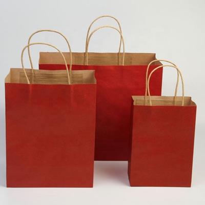 China Recyclable Silk Screen Or Gravure Printing Clothing Packing Recyclable High Quality Handle Kraft Paper Bag for sale