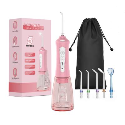 China Hotel Portable Tooth Cleaner Dental Flosser Water Dental Water Jet Oral Irrigator 300ml Water Tank Waterproof for sale