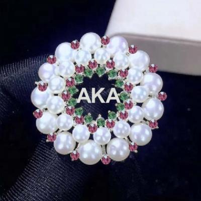 China Classic Big Round Flower Letter Sorority Women Alpha Pink And Green Pearl Greek Brooch for sale