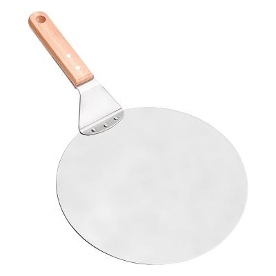 China Premium Round Stocked 10 Inch Handle Paddle Metal Pizza Peel Rubber Wood Spatula Shovel With Cutter For Making Homemade Pizza And Bread Bake for sale