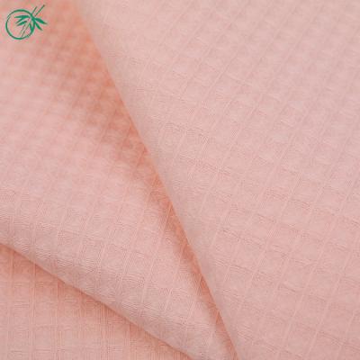 China Viable wholesale stocklot solid woven waffle polyester cotton fabric manufacturer for sale