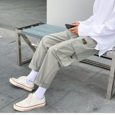 China Breathable Loose Casual Drawstring Men's Hip Hop Chino Pants Loose Trousers for sale