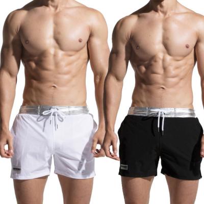 China Anti-Wrinkle Network Triangular Bandage Trunk Swim Trunk Swimsuit Panel Beach Wear Beach Splicing Short Shorts Swim Men Short for sale