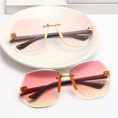 China Fashion Sunglasses Tops Hot Selling Crystal Rimless Children's Sunglasses Shape Shade Boys And Girls Glasses for sale