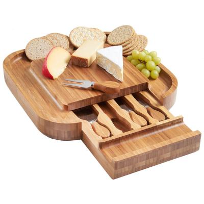 China Sustainable Kitchenware Charcuterie Serving 4 Piece Knife Set Square Slide Out Drawer Luxe Bamboo Cheese Board With Cutlery for sale